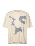 Veisto Unikko Placement Tops T-shirts & Tops Short-sleeved Beige Marimekko