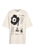 Nopeus Unikko Placement Tops T-shirts & Tops Short-sleeved Cream Marimekko